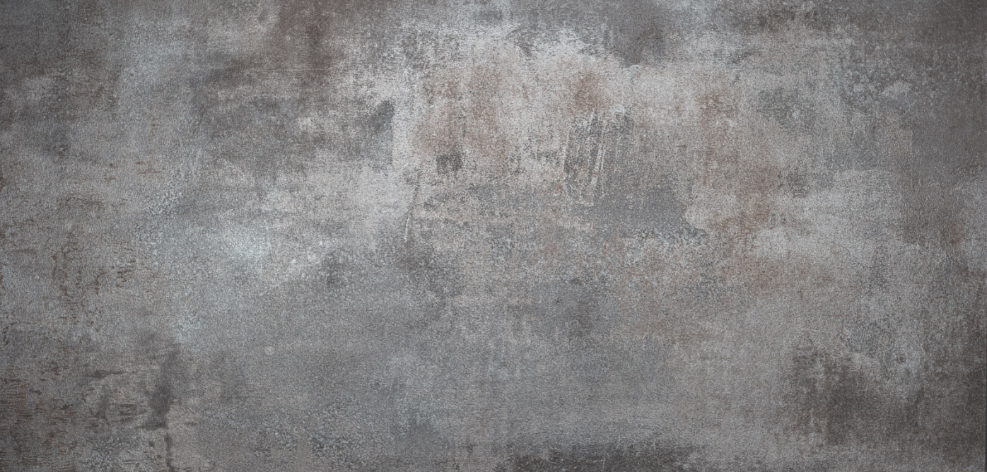 Gray and brown textured concrete wall with uneven, rough surface, subtle color variations, patches, and natural wear, creating a weathered and industrial appearance.