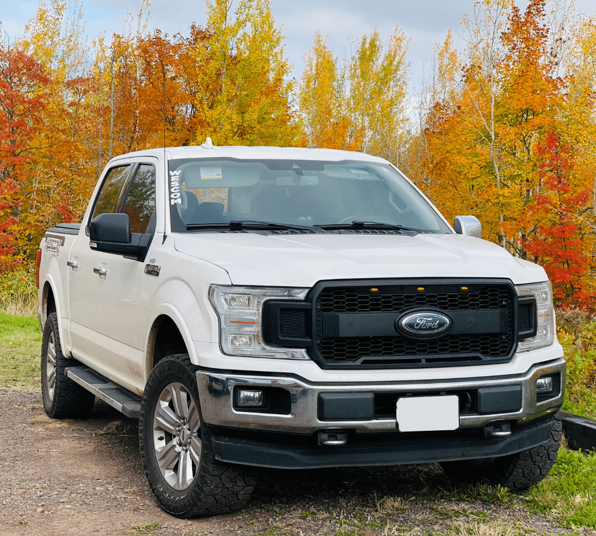 Wescom WINS top 10 hazards include driving. Davin's truck with the fall leaves behind him.