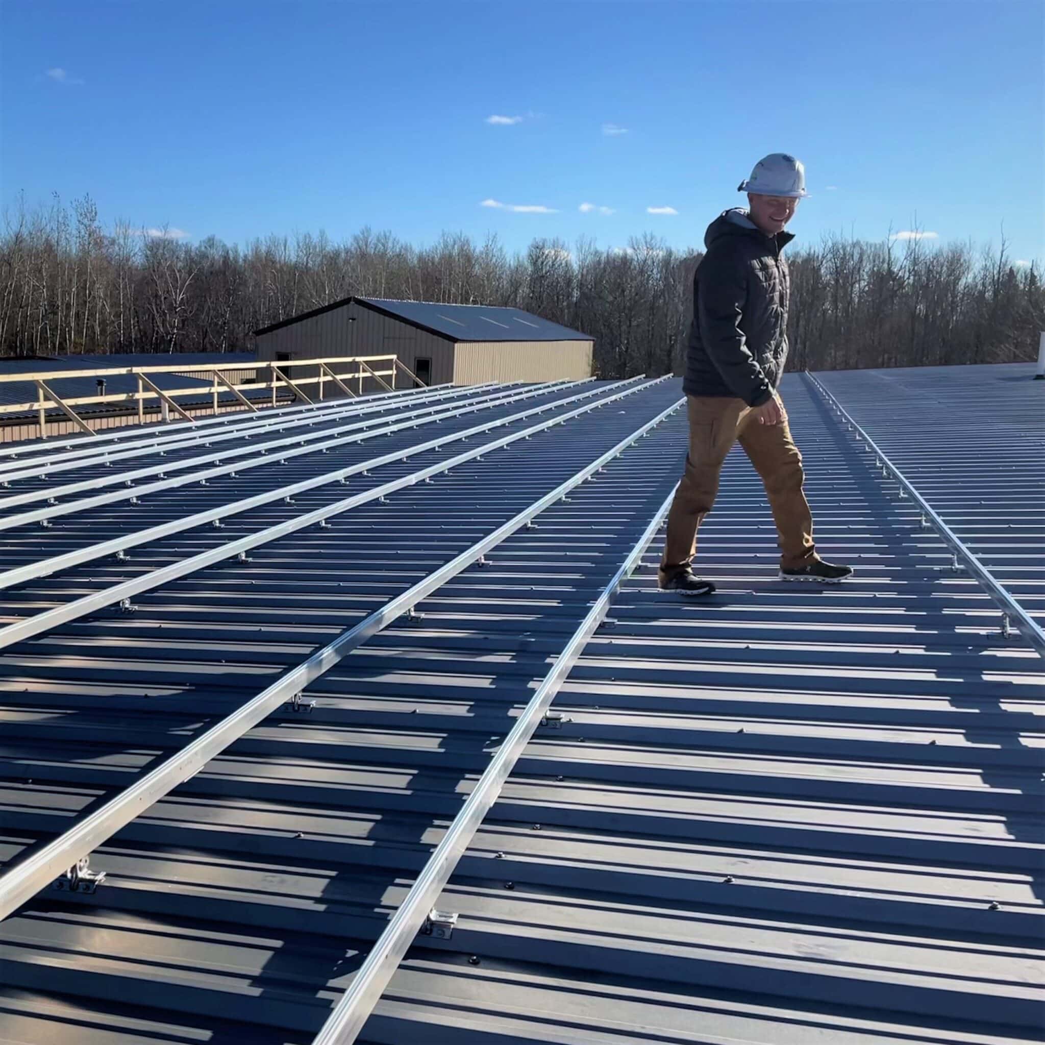 Wescom employee on solar rooftop