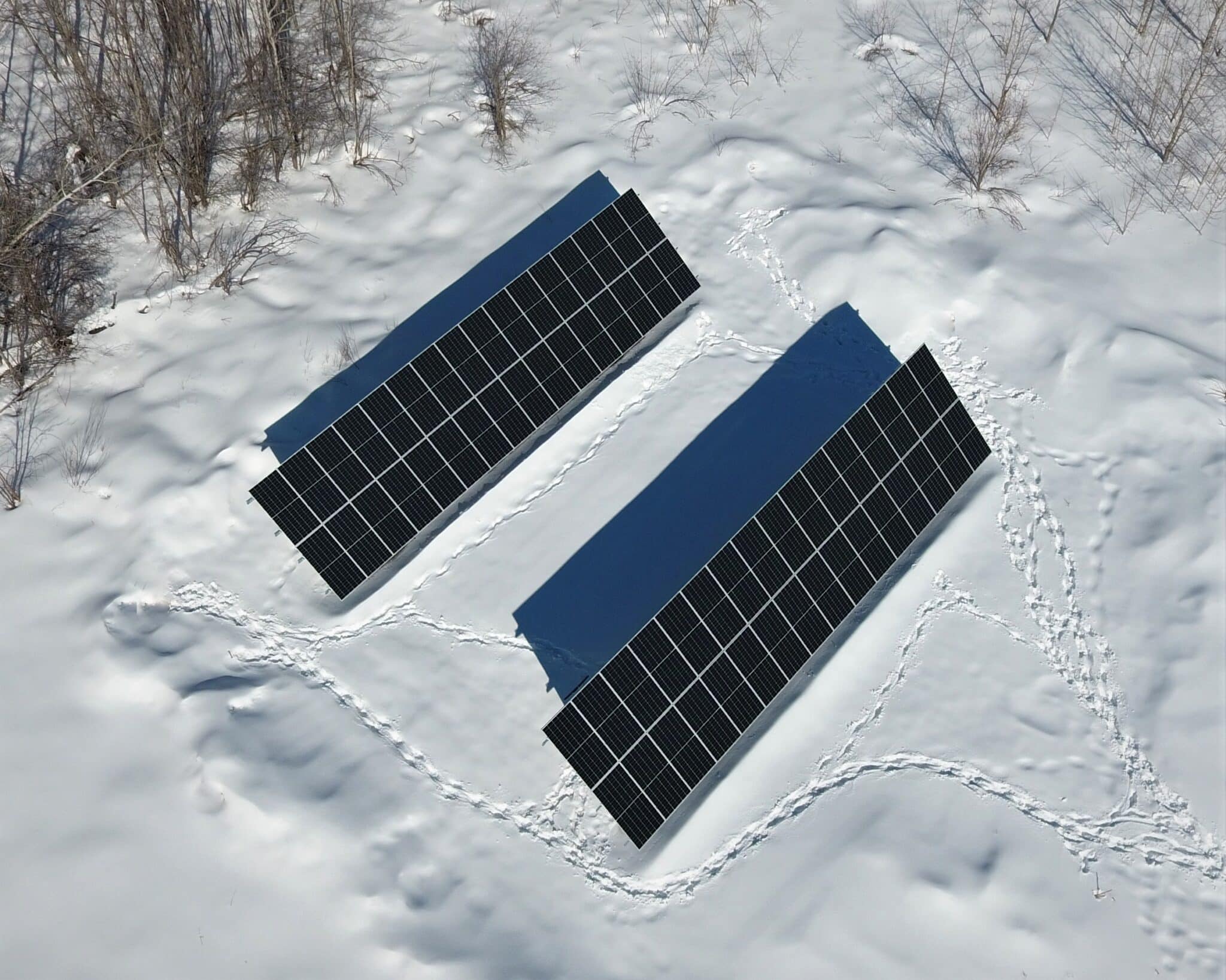 Two full solar arrays surrounded by snow.